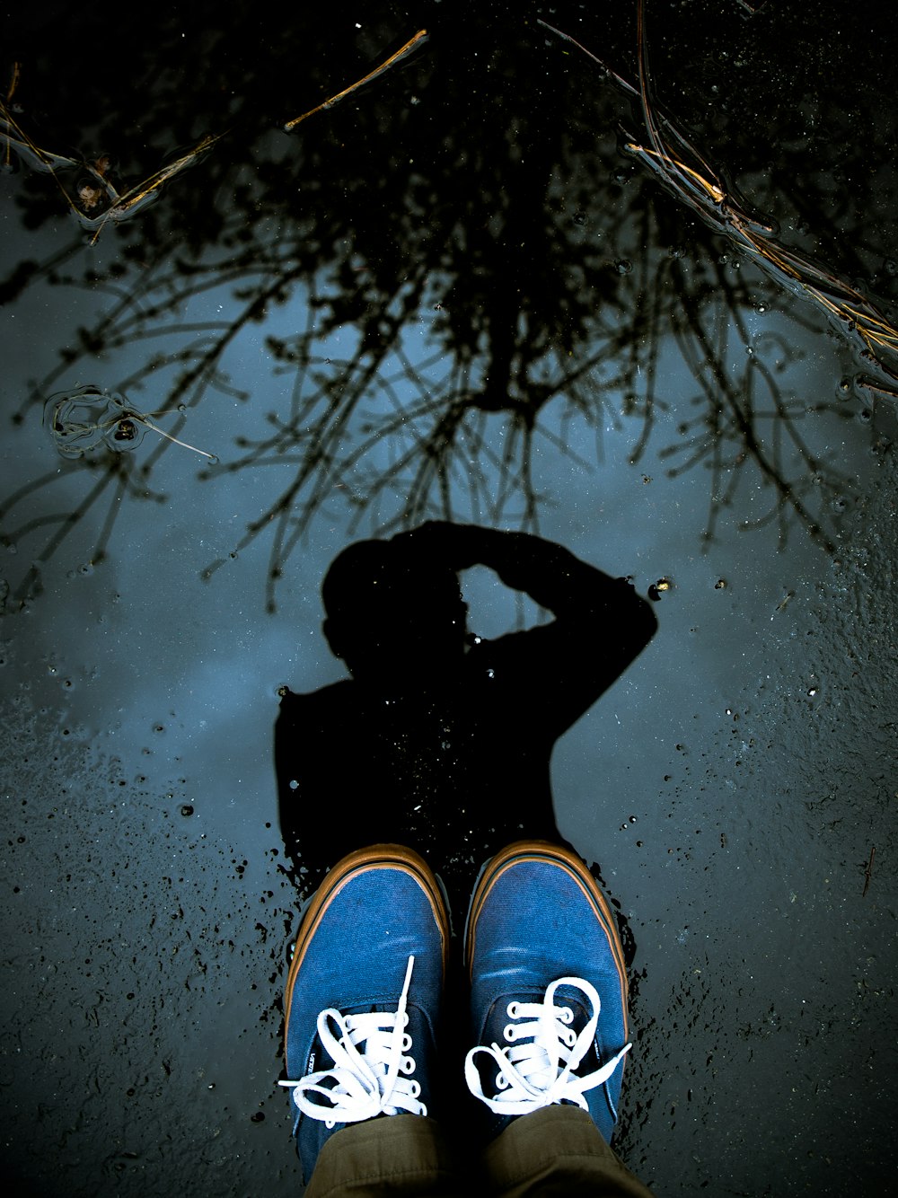 person wearing blue sneakers
