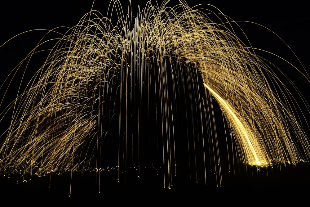 a long exposure of fireworks in the night sky