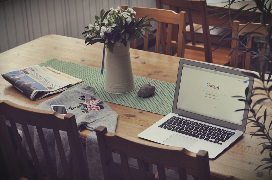 laptop on top of table beside vase of flowers, It is sometimes a good idea to stay at home and work. Not always, but when it happens to have ‘this day’, you just can resist. And that’s totally fine.