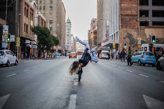 person hand standing on concrete road in Johannesburg South Africa