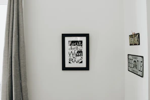 Fernando Sandoval print with visible artist's signature and fine detail shots in a modern interior