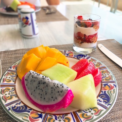 A colorful breakfast spread with fresh juices and vibrant dishes in the morning light.