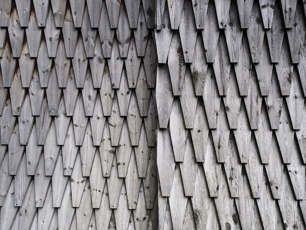 a close up of a building with a wooden roof