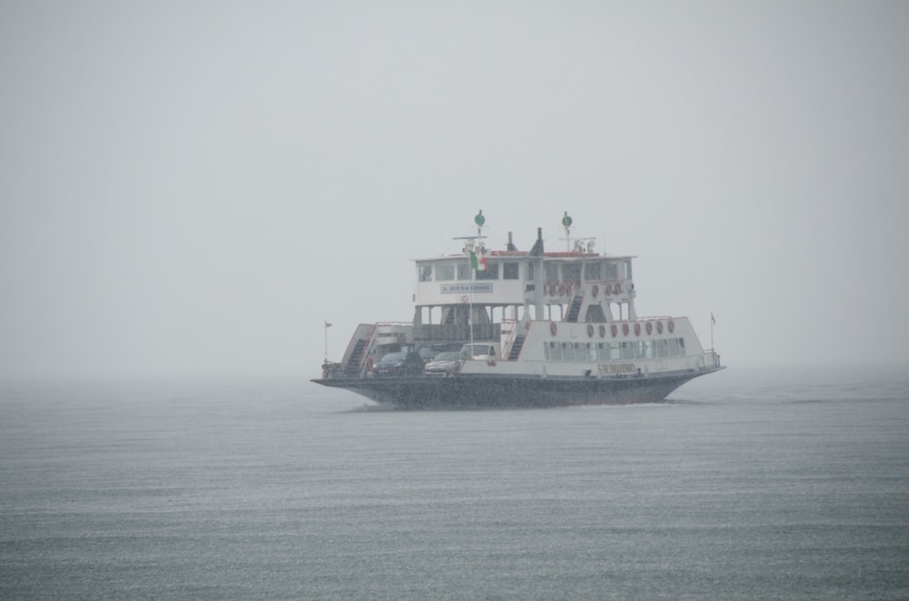 a large boat floating on top of a large body of water