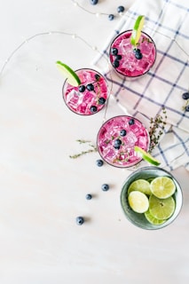pink liquids served in drinking glasses