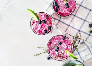 pink liquids served in drinking glasses
