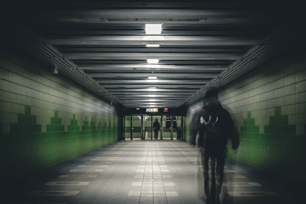 man walking on train subway