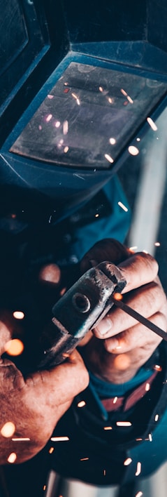 man using welding machine