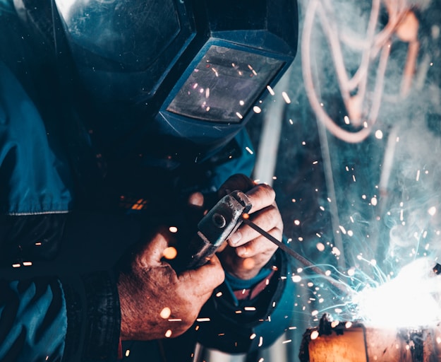 man using welding machine