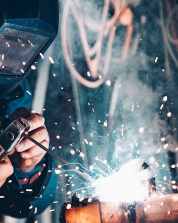 man using welding machine