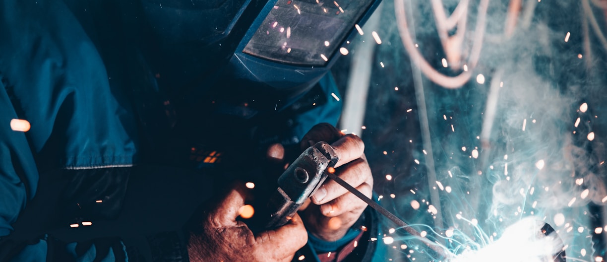 man using welding machine