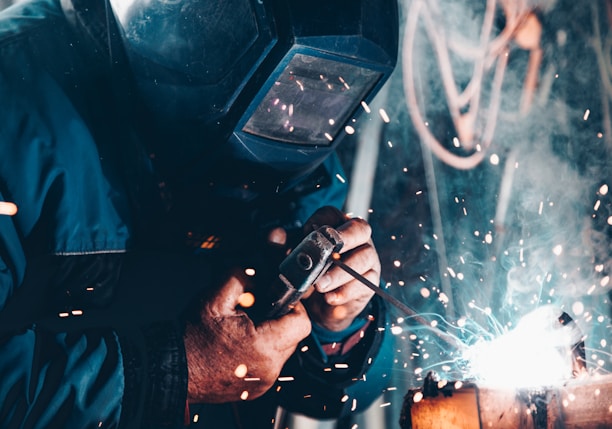 man using welding machine