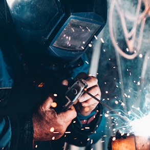 man using welding machine