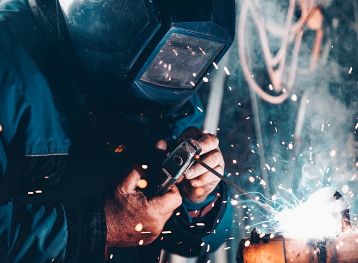 man using welding machine