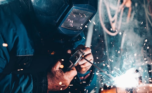 man using welding machine