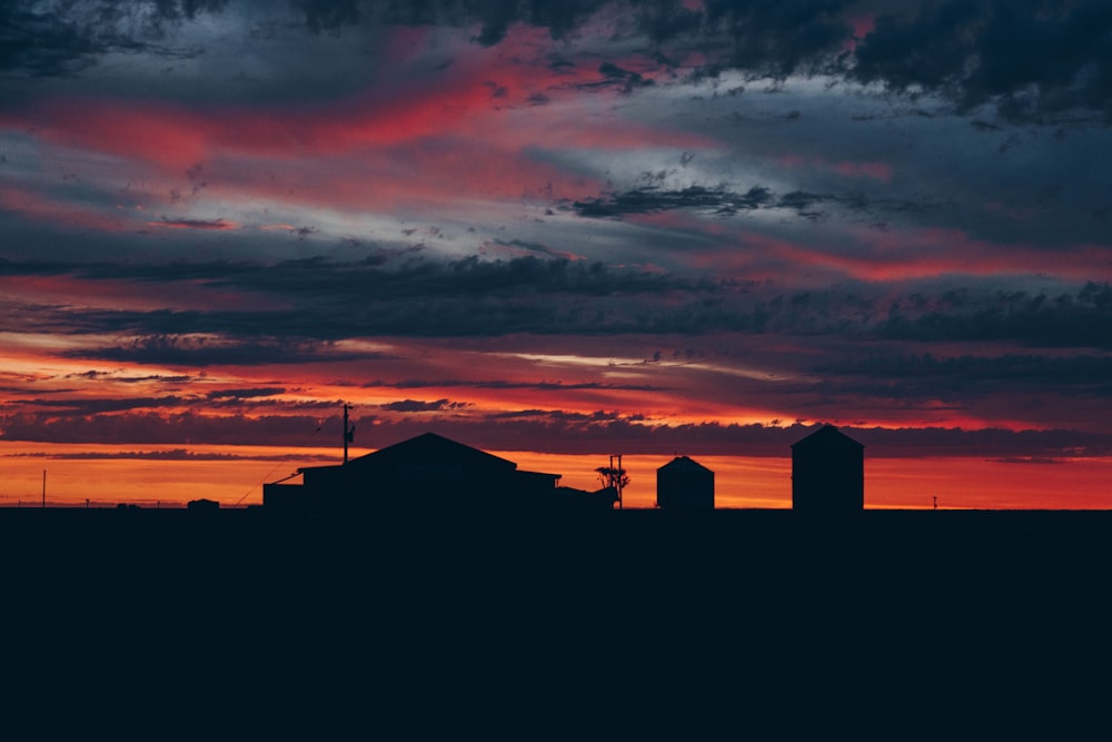 silhouette of house during sunset