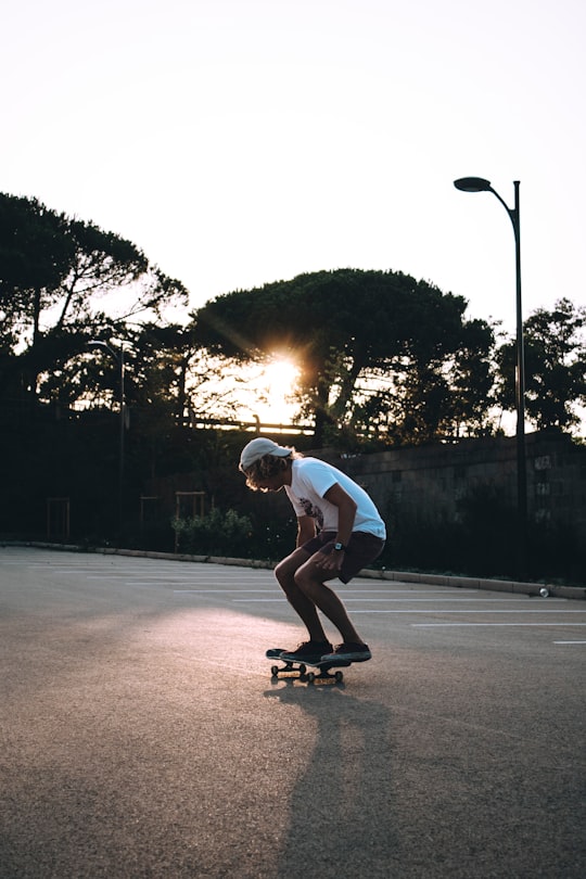 man riding skateboard at the middle of the empty road in La Baule-Escoublac France