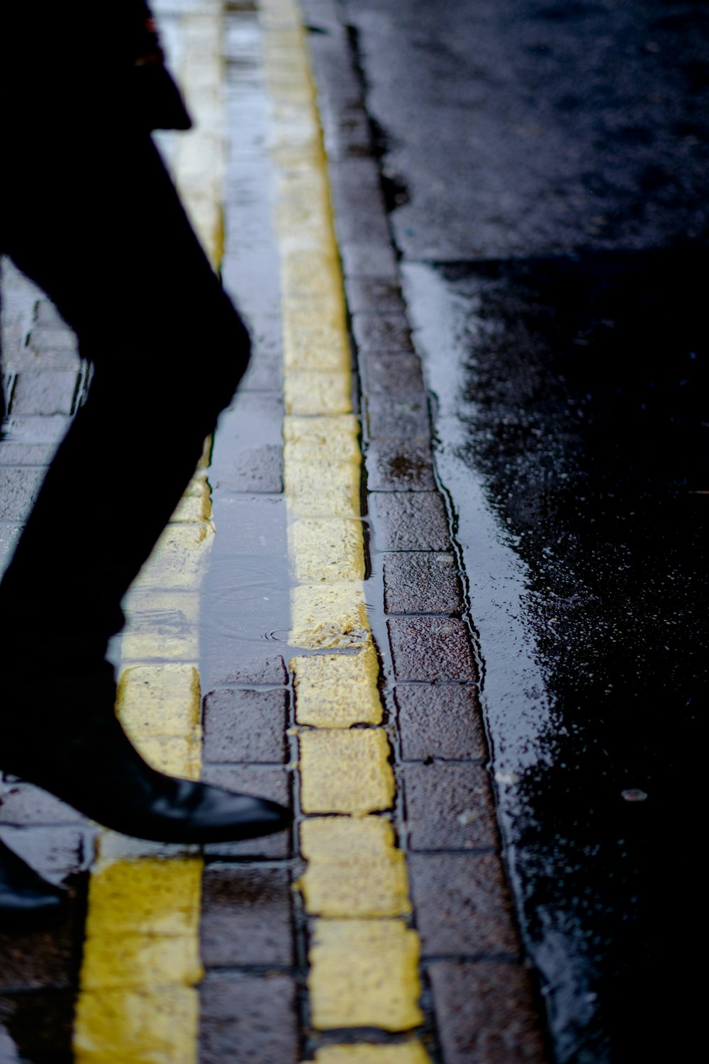 man standing on concrete pavement