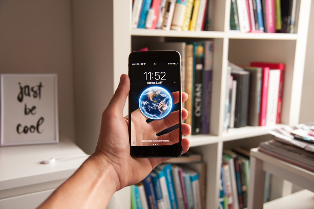 person holding a black Android smartphone