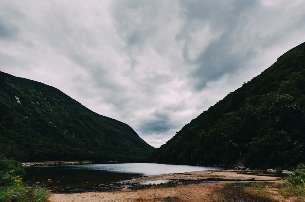 lake between mountain