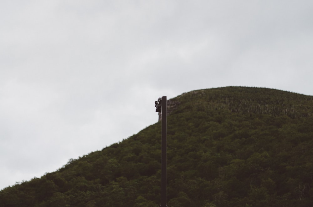 a tall hill with a clock on top of it