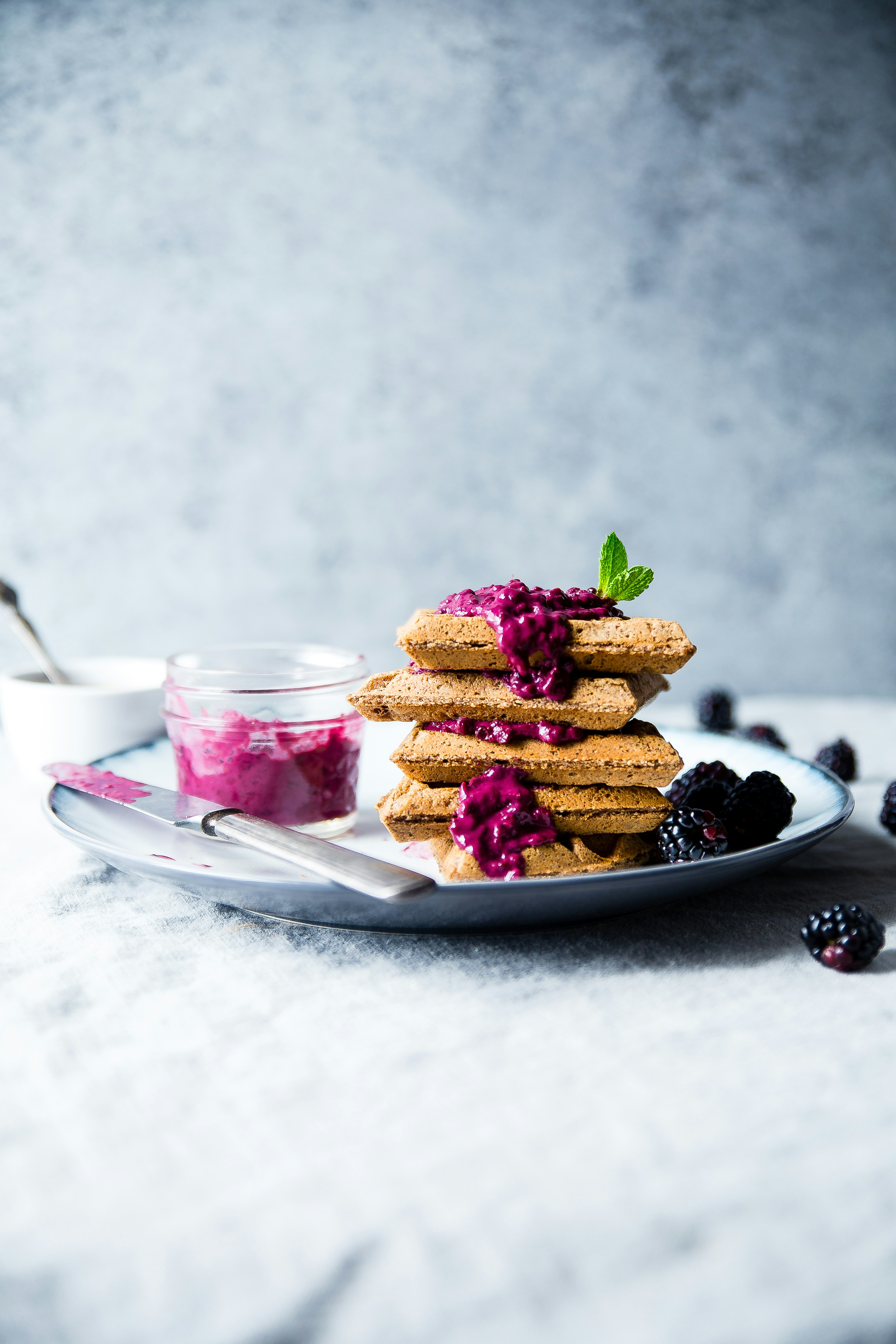 It was a busy morning and I was craving waffles, but I didn’t have time to make a whole batch. So, I created this healthy, single-serving recipe. This photo makes me feel like I want to dive right into the bright purple, drippy sauce and eat it up!