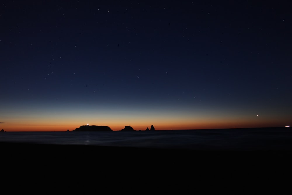 silhouette pf mountain during sunset