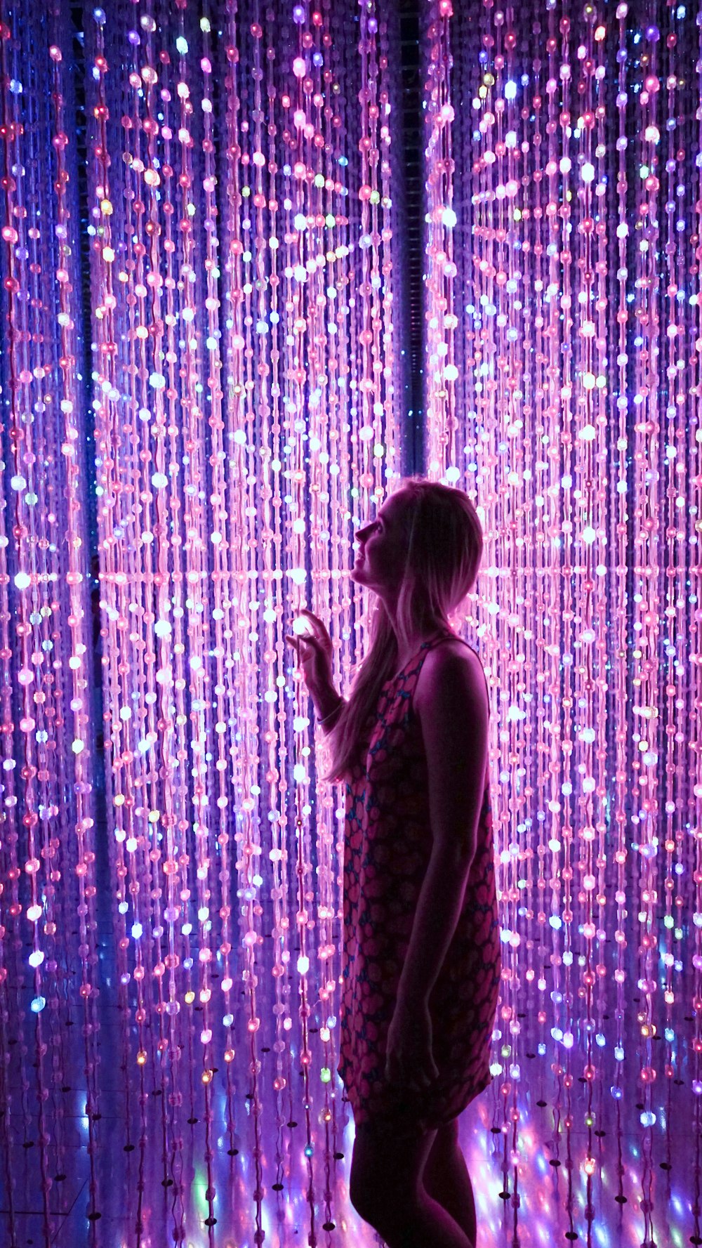 woman standing sting lights