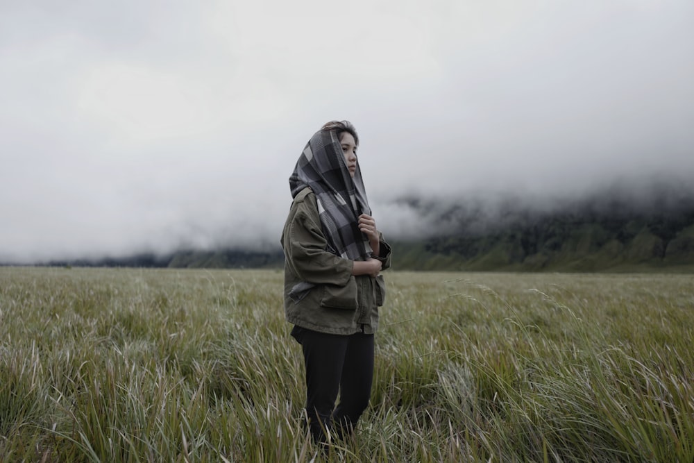 woman standing on grasses