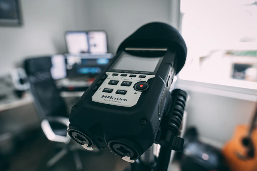 Black and gray portable digital audio recorder on a stand