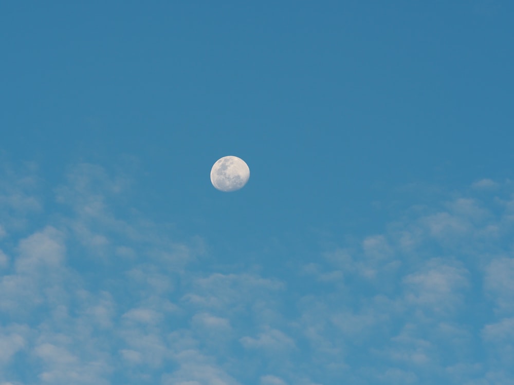 white clouds under full moon