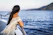 woman on the boat watching the sea