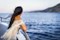woman on the boat watching the sea