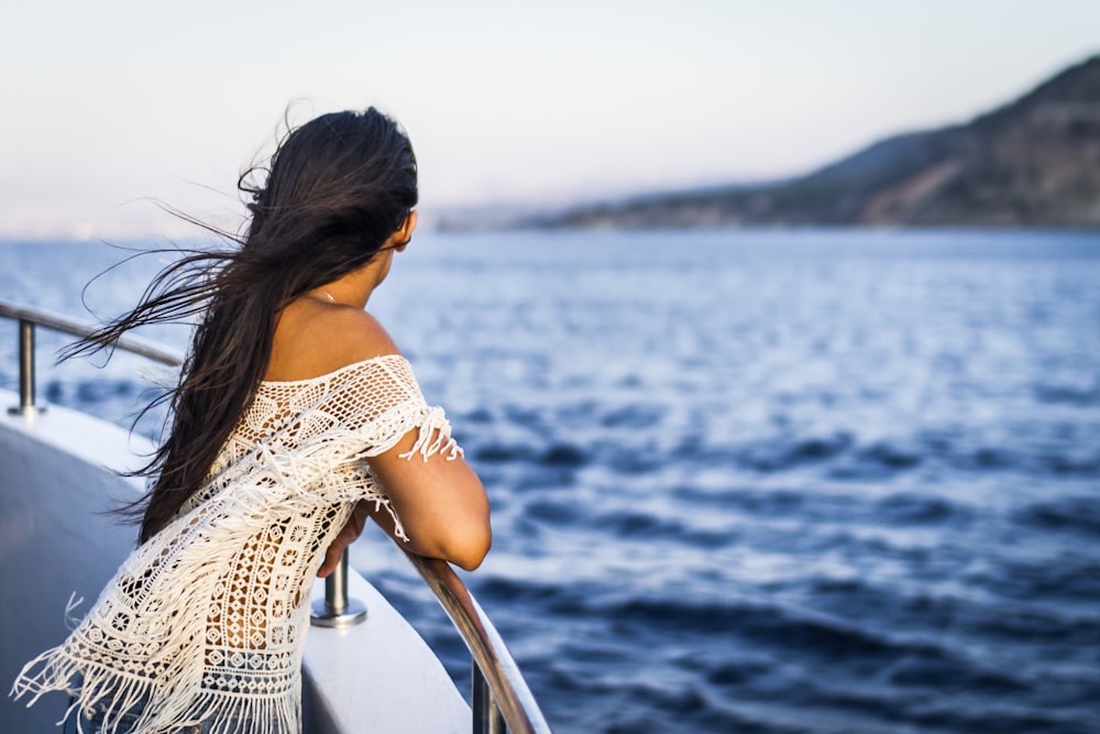 woman on the boat watching the sea