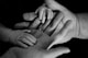 babys hand on human palm