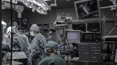people wearing surgical clothes inside operating room