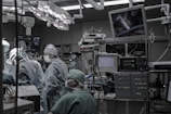 people wearing surgical clothes inside operating room
