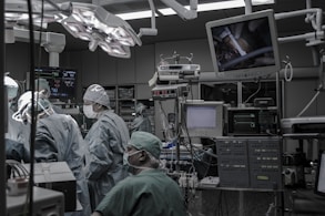 people wearing surgical clothes inside operating room
