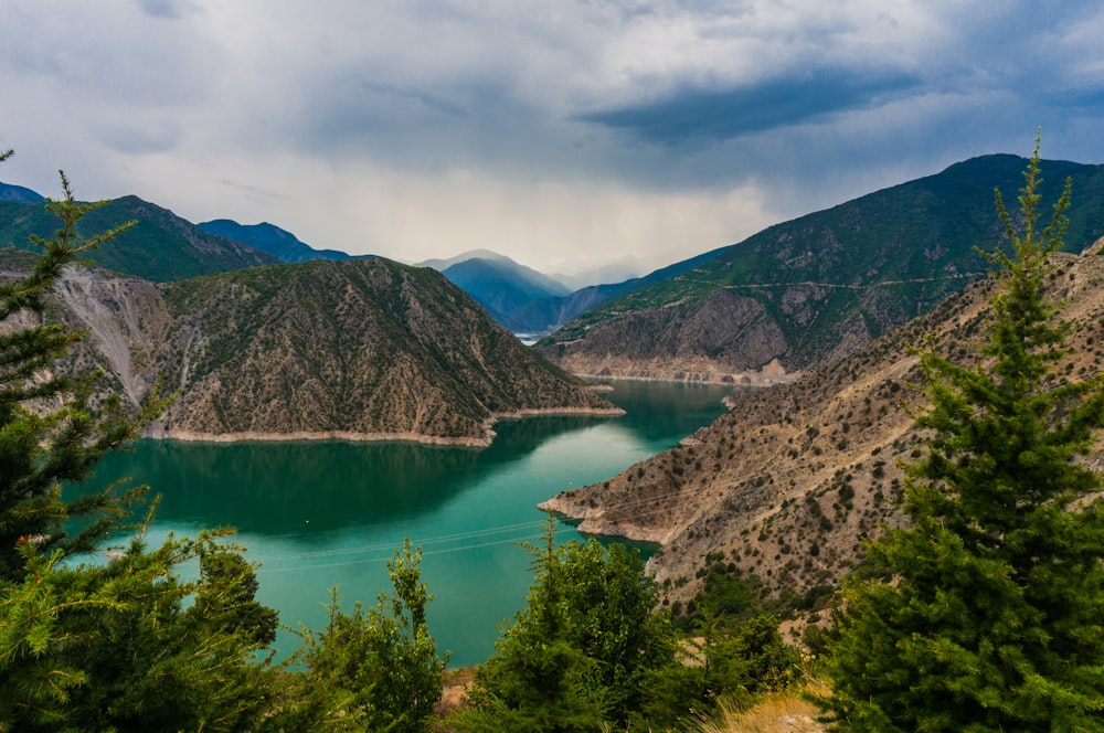 photo of mountain and body of water