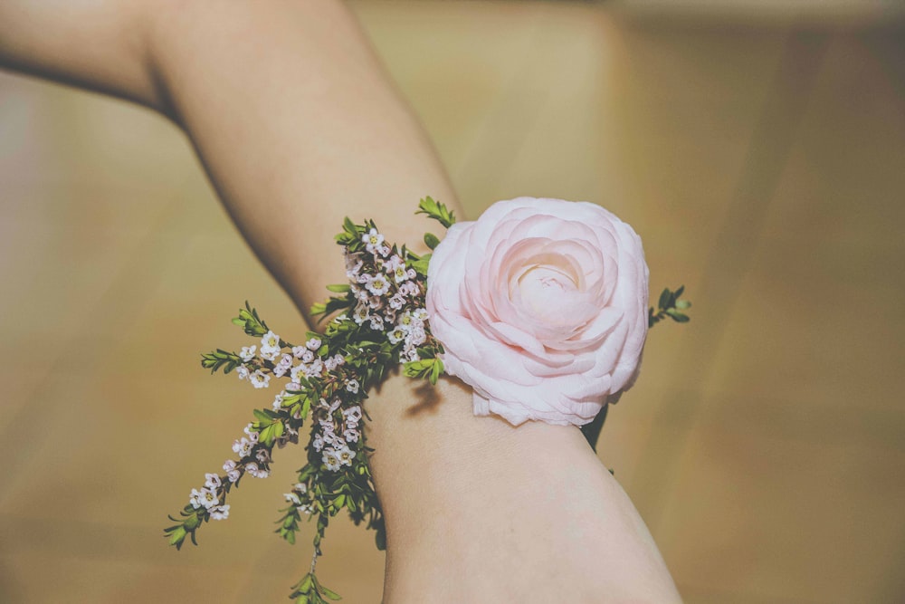 person wearing pink corsage