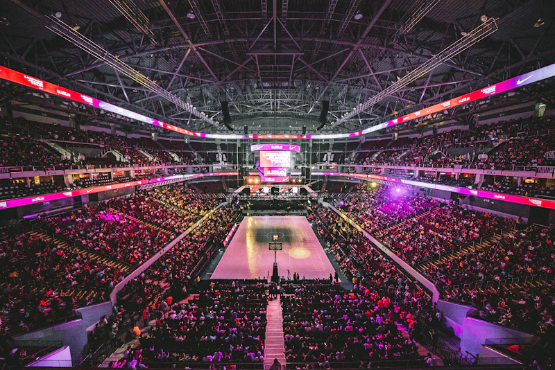A basketball game in a packed arena
