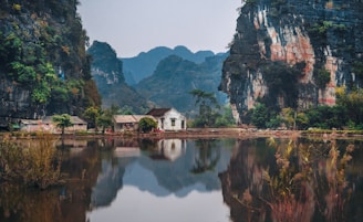 white house between two cliffs