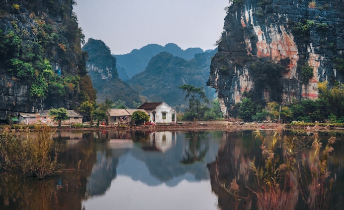 white house between two cliffs