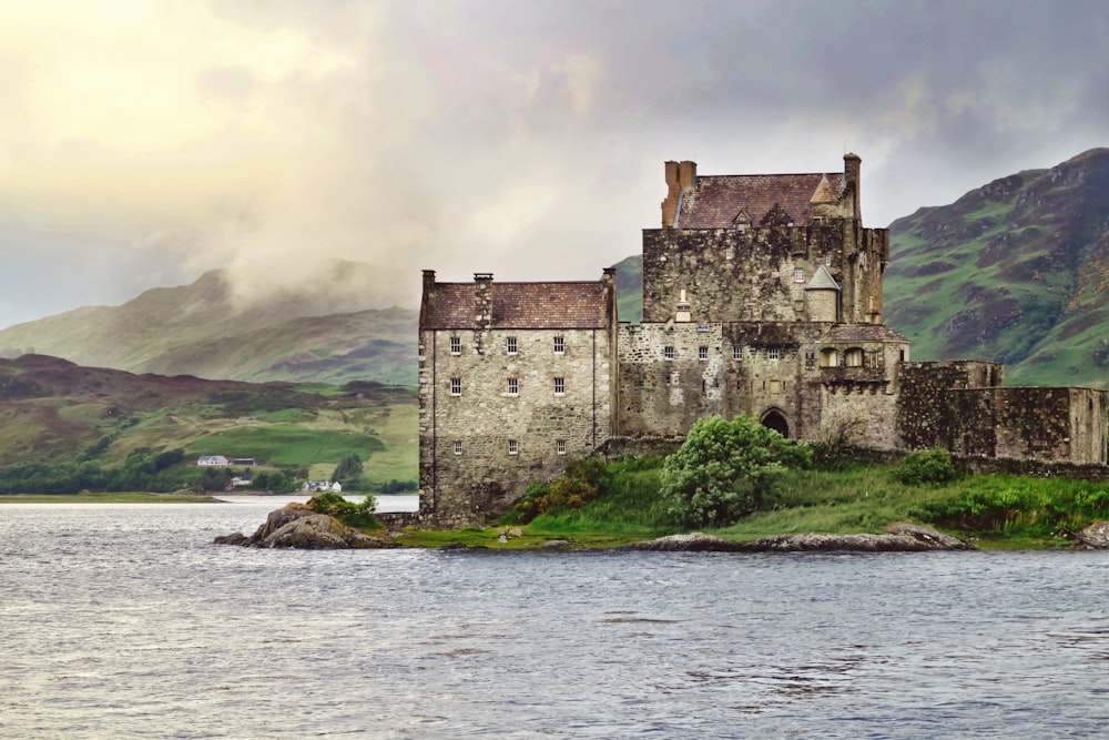 landscape photography of old building near body of water