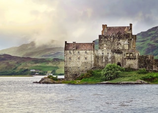 landscape photography of old building near body of water