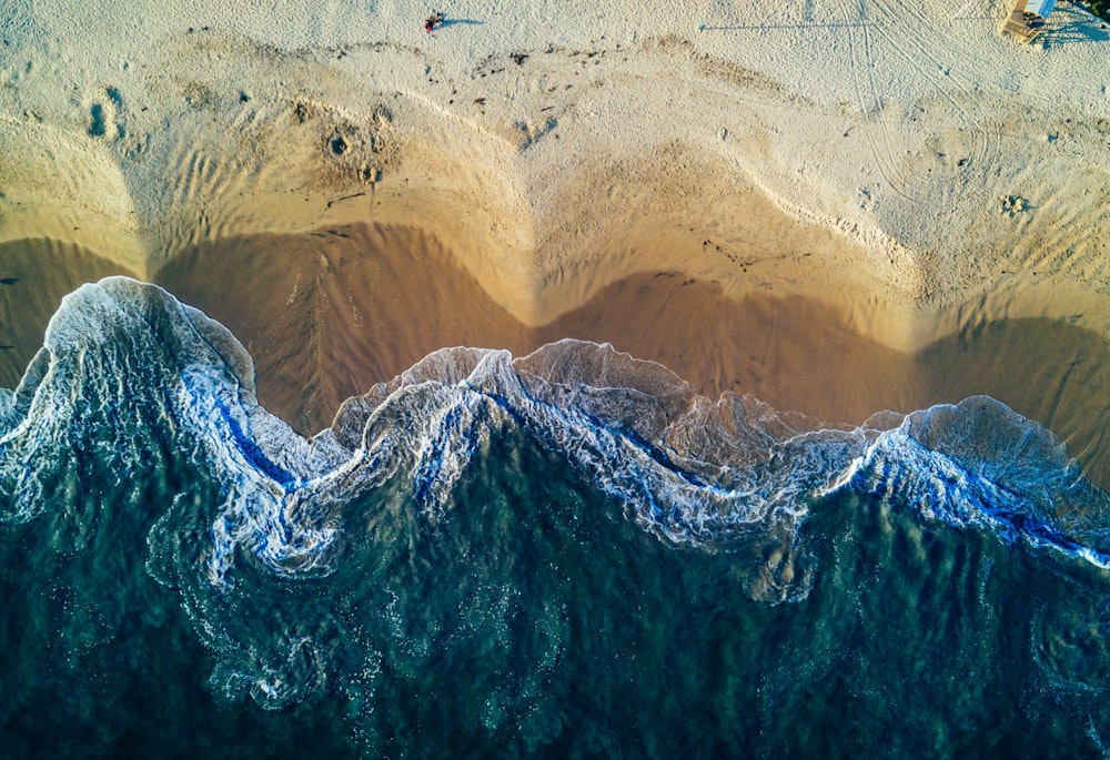 birds eye view photography of white sand seashore