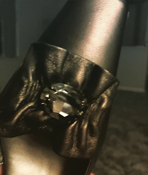 close-up of sapphire structural satin corset with sharp lines and rich texture