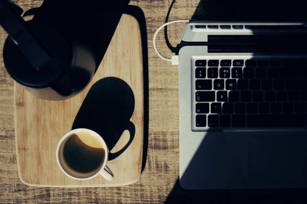 two black and white mugs on rectangular brown tray