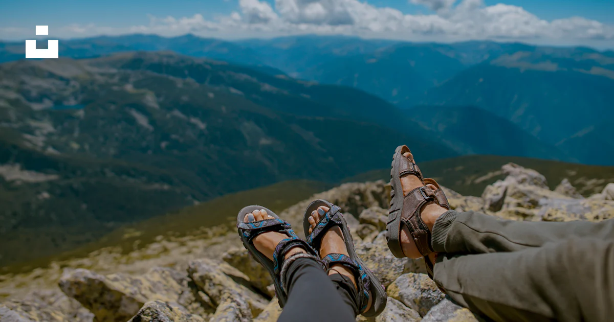 Two person's feet cross leg on gray rocks photo – Free Retezat national ...