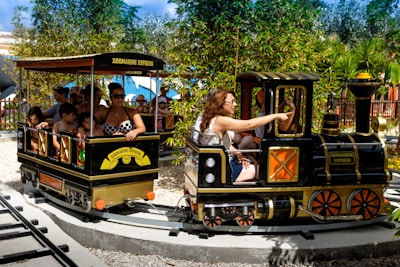Families enjoying a ride on the trackless train at a festival.